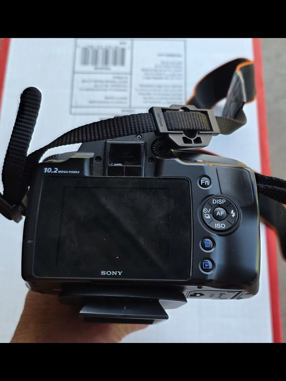 Sony Black DSLR Camera with Black Bag and Orange Interior